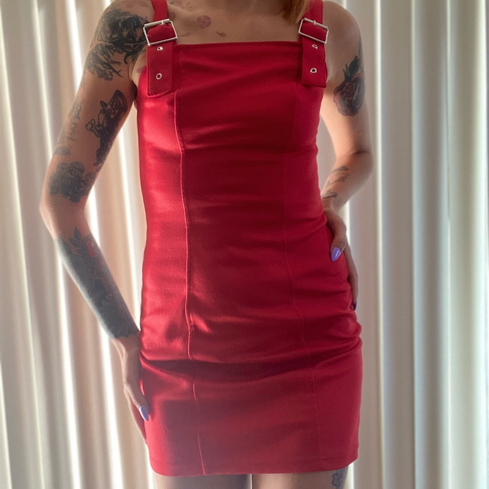 Size small,  “belt type “ adjustable shoulders seems down the hips and bust